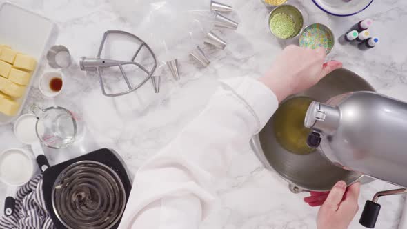 Flat lay. Preparing Italian buttercream frosting in standing kitchen mixer.