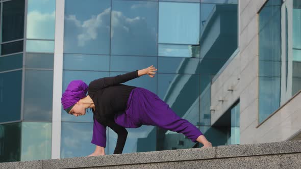 Strong Woman in Hijab Flexible Girl Doing Yoga Exercises on Street City Building Background Sport