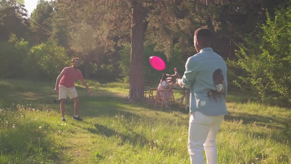 Two Men Playing Flying Disc