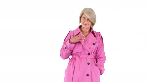 Beautiful Senior Lady in Pink Autumn Outfit on White Background.