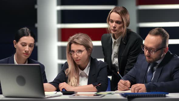 Female Boss Looking Laptop Development Strategy at Team Meeting