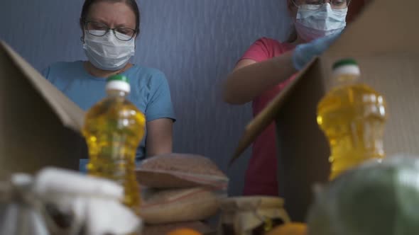 Volunteer in Protective Suits Pack Products.