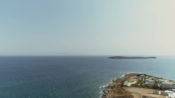 Aerial view of shore at Naousa city, with traditional white houses, Greece.