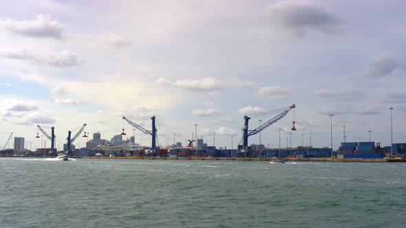 Two boats floating along the Miami Port