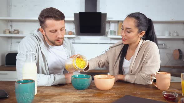 Man and Woman Prepare Breakfast