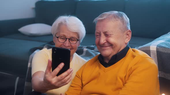 Happy Retired Couple Taking Selfie on the Smartphone