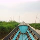 Old Blue Wooden Motor Boat Floats on the Calm River Water Surface Early Morning. Inle Lake, Myanmar - VideoHive Item for Sale
