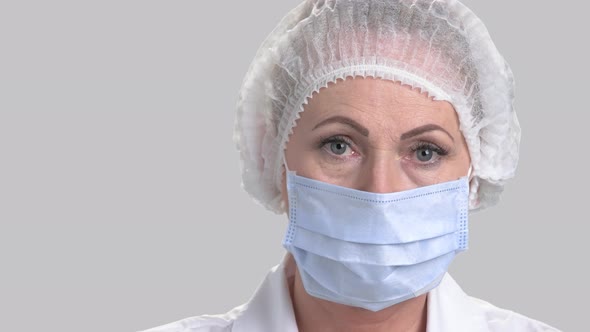 Female Doctor in Cap and Face Mask