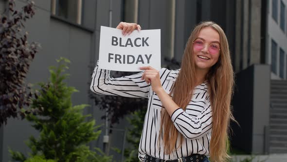 Girl Holding Black Friday Text Inscription, Rejoicing Good Discounts, Low Prices for Online Shopping