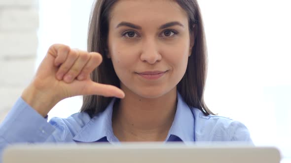 Thumbs Down, Frustrated Woman Gesture while Sitting in Office