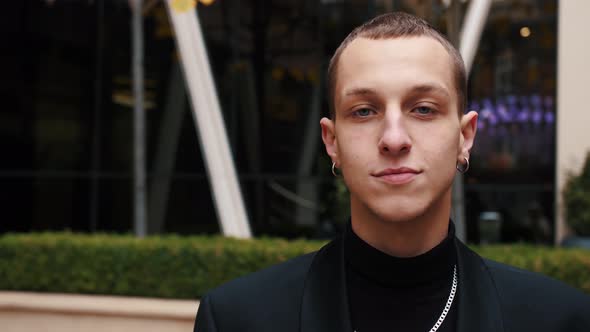 Portrait of Young Caucasian Man Smiling Outside Urban City Business Office