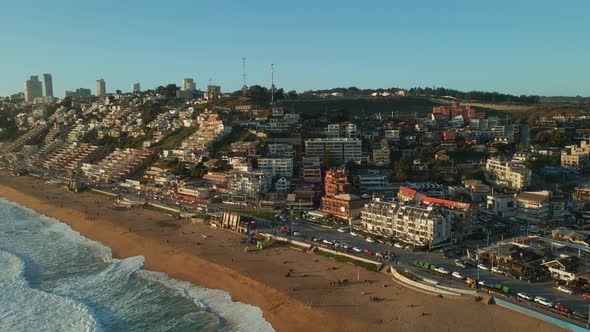 Aerial view flying towards Reñaca Chile scenic resort cityscape golden beach waterfront coastline