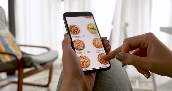 Woman Ordering Pizza at Home Online