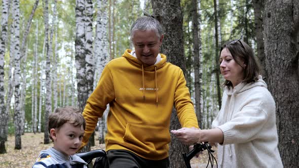 Family bike ride in the park