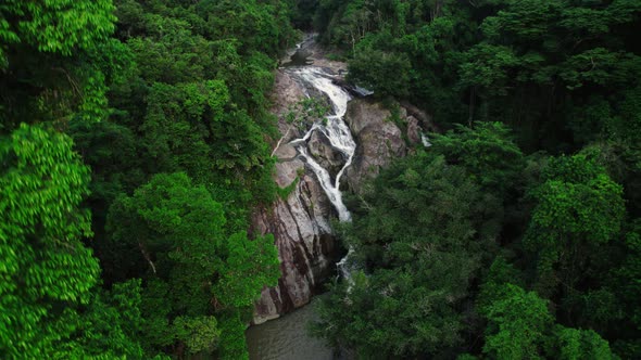 Ascending shot over Hin Lat waterfall in the middle of the jungle in Koh Samui