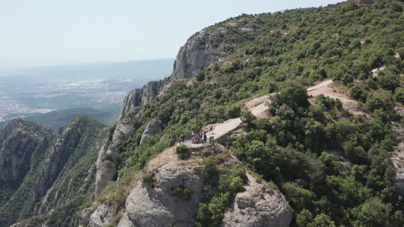 Drone Flight Over Rock with Cross of Saint Michael