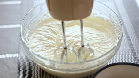 Whipping Cream Cheese in a Glass Bowl