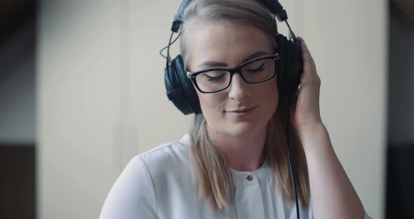 Woman Listen Music in Headphones