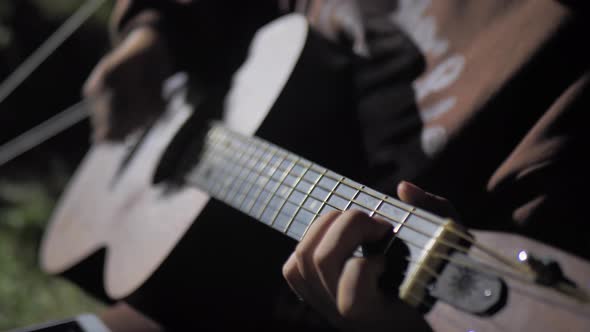 Playing the Guitar at Campfire