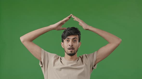 Hispanic Young Man Arabian Guy Raise Hands Over Head Make House Roof Frame Gesture with Arms Feel