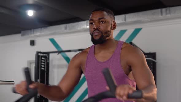 African American Man Workout on Velosimulator in the Gym