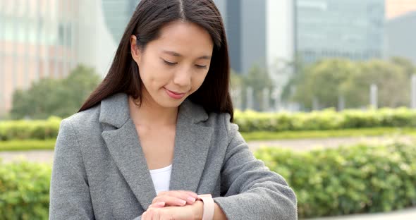 Young business woman use of smart watch