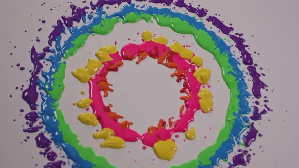 Color Drops In A Circle On A White Background