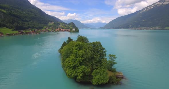 Aerial travel drone view of Iseltwald, Lake Brienz, Switzerland.