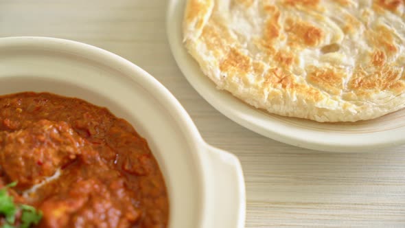 chicken tikka masala spicy curry meat food with roti or naan bread - Indian food style