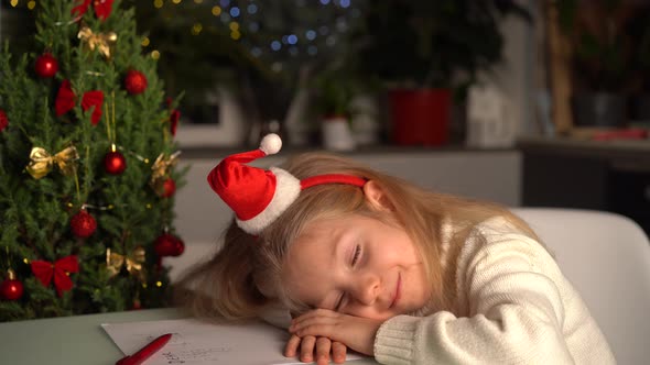 a Little Blonde Girl Writes a Letter to Santa Claus Gifts for Christmas a Happy Child