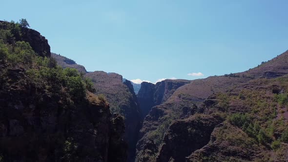 Beautiful aerial views of the mountains, a small river and the canyon