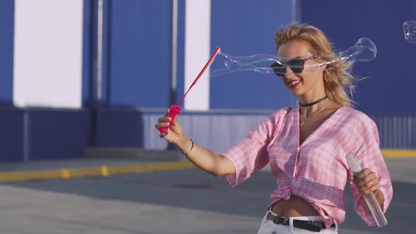 Attractive Young Woman Makes Soap Bubbles on Street  Slow Motion 120 Fps