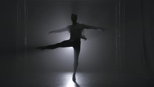 A Pirouette Performed By a Young Talented Male Ballet Dancer. Silhouette in the Spotlight