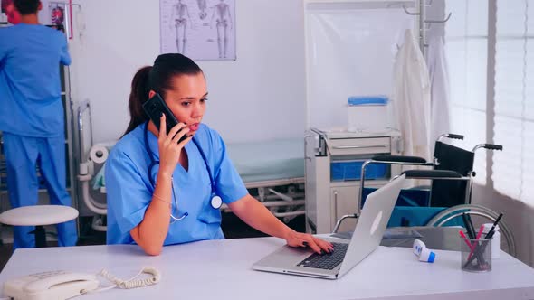 Nurse Physician Consulting Remote Patient Using Smartphone