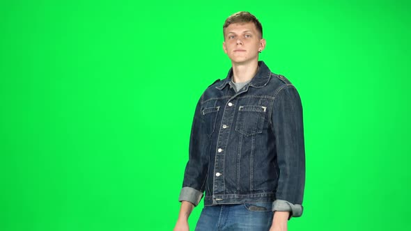 Young Man Walking and Greeting on a Green Screen, Chroma Key