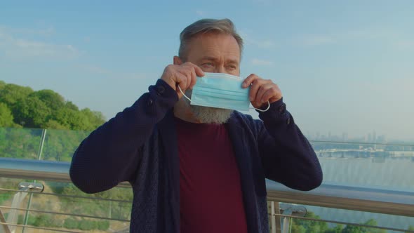 Portrait of Bearded Senior Man Wearing Medical Mask in Quarantine Mode