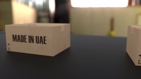 Boxes with MADE IN UAE Text on Conveyor