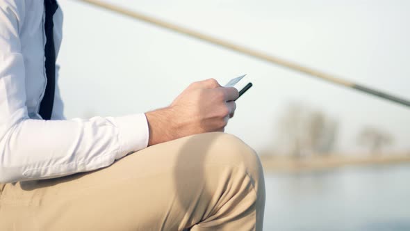 Businessman Making Online Payment Holding Bank Card. Man Checking Money Balance On Credit Card.