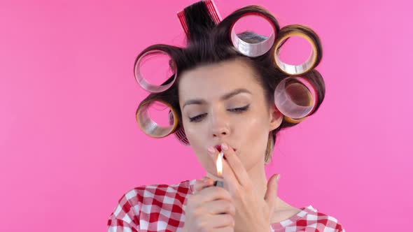 Woman in Hair Rollers Lighting Cigarette