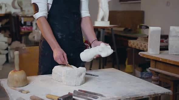 Sculptor  in His Hand Pencil and Completed Sculpture Calculating the Sizes of Future One