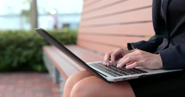 Business woman work on laptop computer at outdoor