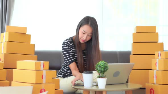 Woman with packing box ready for shipping