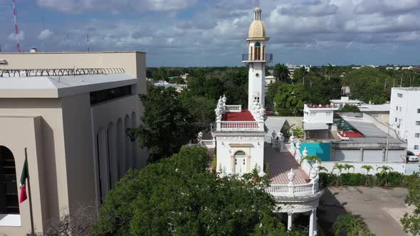 Aerial trucking shot to the right of the el Minaret mansion on the Paseo de Montejo in Merida, Yucat