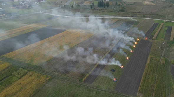 Aerial View of Agricultural Waste Bonfires From Dry Grass and Straw Stubble Burning with Thick Smoke