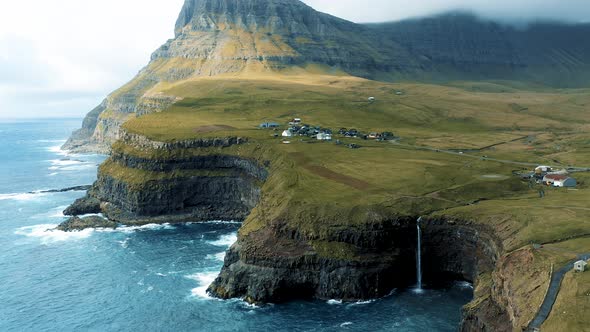 Aerial View of Gasadalur Village and Mulafossur Waterfall in the Faroe Islands