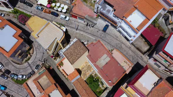 Flying Over the small Sicilian village on top of the mountain; revealing narrow roads and small hous