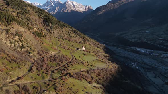 Aerial View of a Small Church in the Beautiful Mountains of Georgia