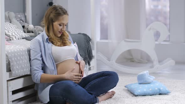 Beautiful Pregnant Woman Talking To Unborn Child