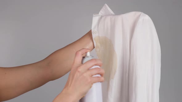 Woman Uses Stain Remover Spray for Office White Shirt with Coffee Stain