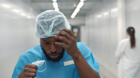 Young African Surgeon Man Feeling Sick and Coughing at Work